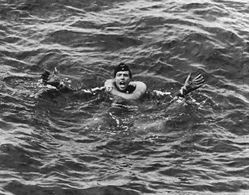 Obersteurmann Helmut Klotzch yells for help after his submarine, U-175, is sunk in the Atlantic by U.S. Coast Guard Cutter __Spencer, __April 1943. The sub was just about to attack an Allied convoy.  Klotzch was rescued by __Spencer__.